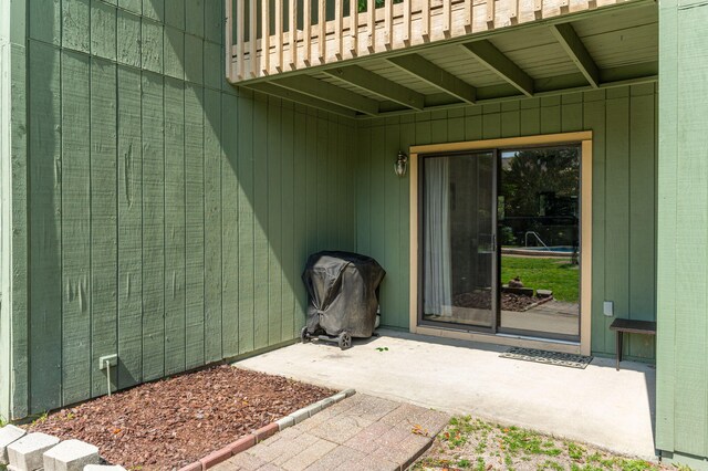 115 NE Hughes St Unit B3, Fort Walton Beach, FL 32548 - view of exterior entry featuring a balcony and a patio