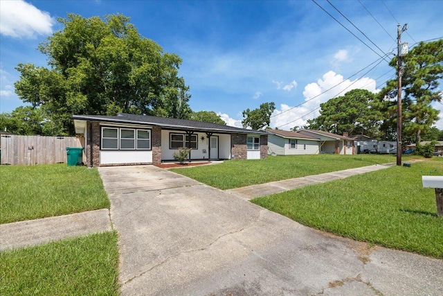 1008 Aspen Ct, Fort Walton Beach, FL 32547 - ranch-style home with concrete driveway and brick siding
