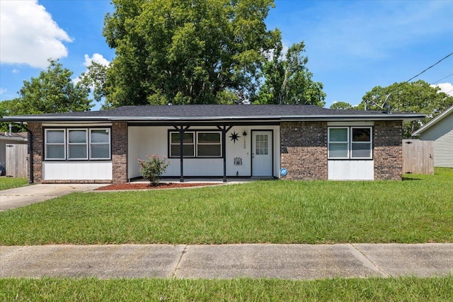 1008 Aspen Ct, Fort Walton Beach, FL 32547 - ranch-style house featuring brick siding, a front lawn, and a porch