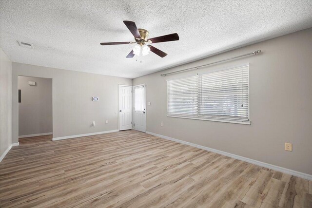 1008 Aspen Ct, Fort Walton Beach, FL 32547 - entrance foyer with a textured ceiling, light wood-style flooring, a ceiling fan, and baseboards
