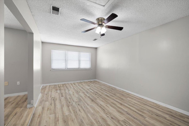 1008 Aspen Ct, Fort Walton Beach, FL 32547 - empty room featuring a textured ceiling, light wood finished floors, a ceiling fan, and baseboards