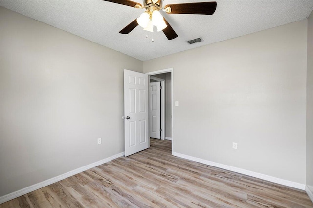 1008 Aspen Ct, Fort Walton Beach, FL 32547 - empty room with light wood-style flooring, baseboards, ceiling fan, and a textured ceiling