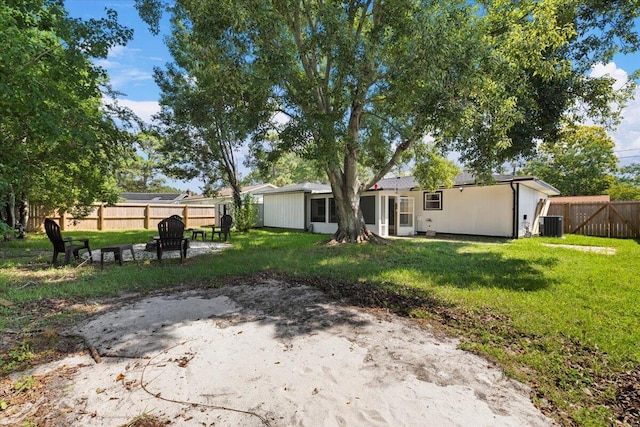 1008 Aspen Ct, Fort Walton Beach, FL 32547 - view of yard with an outdoor fire pit and central AC unit
