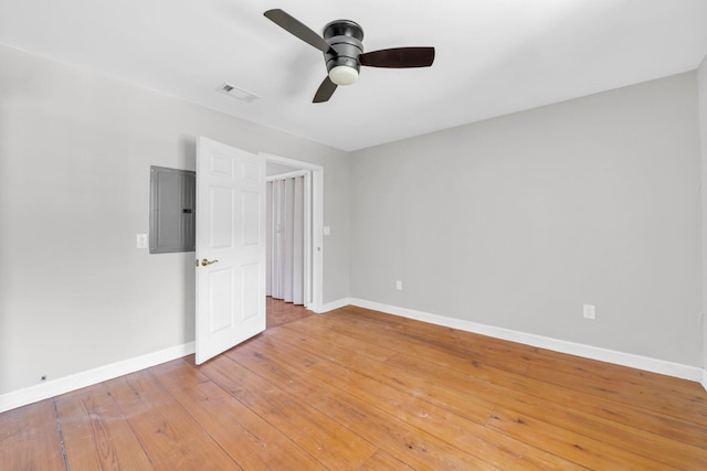 891 Choctawhatchee River Rd, Ponce De Leon, FL 32455 - empty room featuring electric panel, baseboards, ceiling fan, and light wood-style flooring