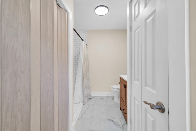 891 Choctawhatchee River Rd, Ponce De Leon, FL 32455 - full bath with marble look tile flooring, toilet, vanity, a shower with shower curtain, and baseboards