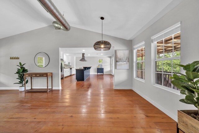 891 Choctawhatchee River Rd, Ponce De Leon, FL 32455 - living area with lofted ceiling, baseboards, and hardwood / wood-style flooring