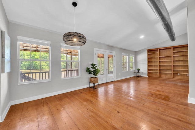 891 Choctawhatchee River Rd, Ponce De Leon, FL 32455 - unfurnished living room with baseboards, vaulted ceiling, light wood finished floors, and french doors