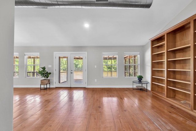 891 Choctawhatchee River Rd, Ponce De Leon, FL 32455 - unfurnished living room featuring hardwood / wood-style flooring, baseboards, and french doors