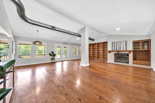891 Choctawhatchee River Rd, Ponce De Leon, FL 32455 - unfurnished living room with vaulted ceiling, healthy amount of natural light, baseboards, and hardwood / wood-style flooring