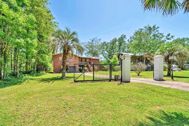 891 Choctawhatchee River Rd, Ponce De Leon, FL 32455 - view of yard with driveway, a carport, and a gate