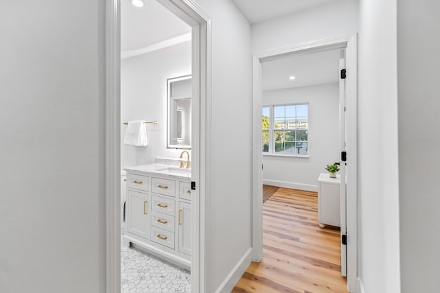 43 Summer Haven Trl Unit 3, Miramar Beach, FL 32550 - corridor with a sink, light wood-style flooring, baseboards, and recessed lighting
