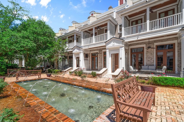 9201 Market St Inn Unit 159, Miramar Beach, FL 32550 - view of patio / terrace with a balcony, french doors, an outdoor pool, and a ceiling fan