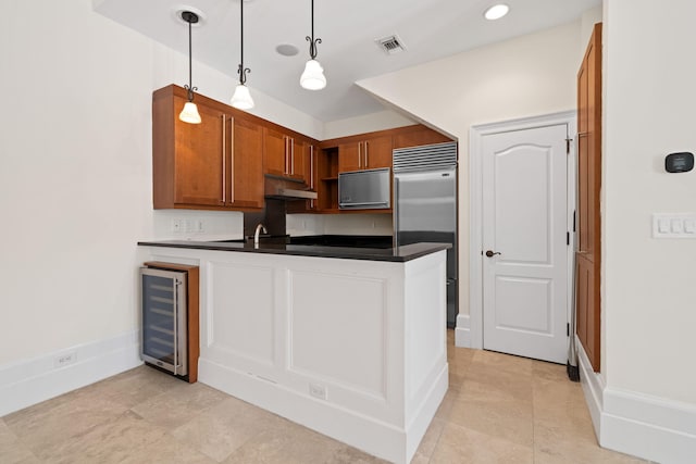 9201 Market St Inn Unit 159, Miramar Beach, FL 32550 - kitchen with beverage cooler, stainless steel built in refrigerator, dark countertops, a peninsula, and under cabinet range hood