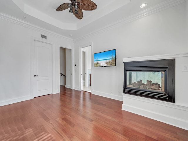 9201 Market St Inn Unit 159, Miramar Beach, FL 32550 - unfurnished living room with a raised ceiling, ceiling fan, wood finished floors, recessed lighting, and baseboards