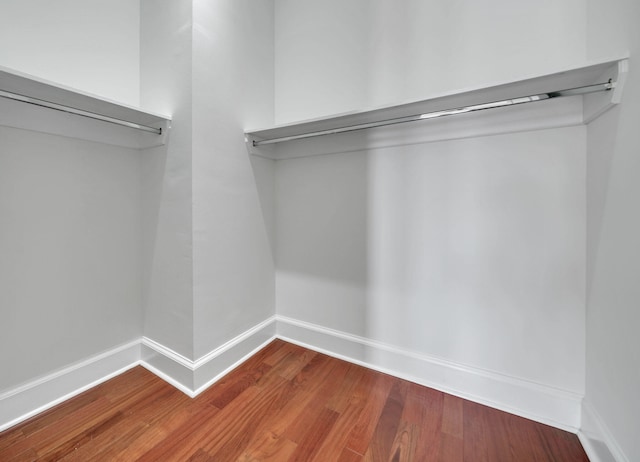 9201 Market St Inn Unit 159, Miramar Beach, FL 32550 - spacious closet featuring dark wood-style floors