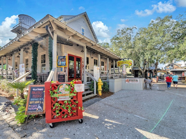 9201 Market St Inn Unit 159, Miramar Beach, FL 32550 - view of home's exterior with a ceiling fan and a porch