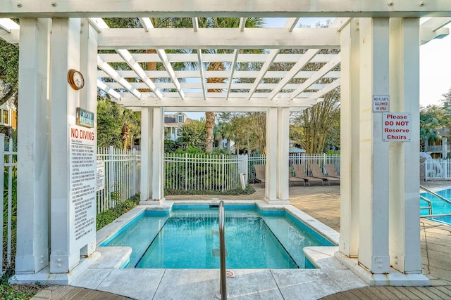 9201 Market St Inn Unit 159, Miramar Beach, FL 32550 - view of pool featuring a swimming pool and a pergola