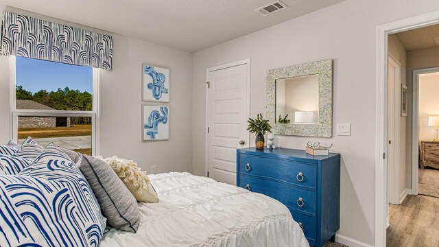 3064 Heritage Plantation Blvd, Laurel Hill, FL 32567 - bedroom featuring baseboards and wood finished floors