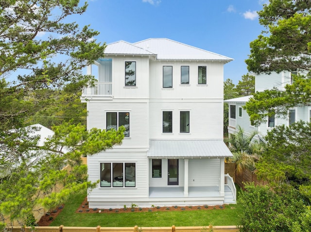 55 May Dr, Santa Rosa Beach, FL 32459 - rear view of property with metal roof and a porch