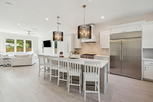 55 May Dr, Santa Rosa Beach, FL 32459 - kitchen with stainless steel built in fridge, premium range hood, a sink, tasteful backsplash, and open floor plan