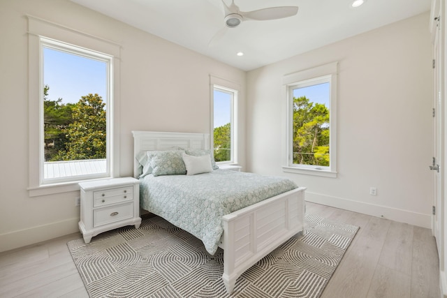 55 May Dr, Santa Rosa Beach, FL 32459 - bedroom with multiple windows, baseboards, recessed lighting, light wood finished floors, and a ceiling fan