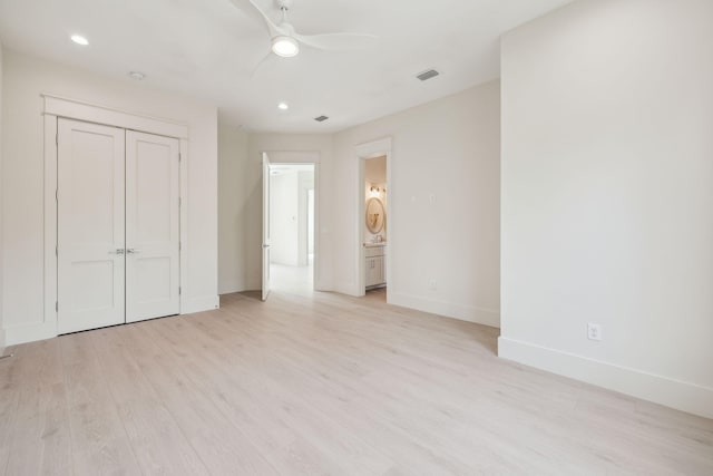 55 May Dr, Santa Rosa Beach, FL 32459 - unfurnished bedroom featuring baseboards, light wood-type flooring, recessed lighting, ensuite bathroom, and a ceiling fan