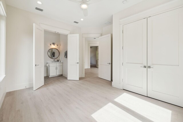 55 May Dr, Santa Rosa Beach, FL 32459 - unfurnished bedroom featuring light wood-type flooring, baseboards, a closet, and recessed lighting