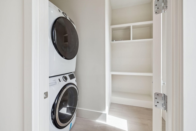 55 May Dr, Santa Rosa Beach, FL 32459 - laundry area with estacked washer and dryer and baseboards