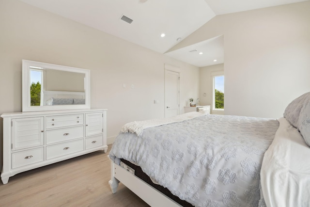 55 May Dr, Santa Rosa Beach, FL 32459 - bedroom featuring lofted ceiling, light wood-type flooring, and recessed lighting