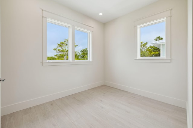55 May Dr, Santa Rosa Beach, FL 32459 - empty room with healthy amount of natural light, baseboards, light wood finished floors, and recessed lighting