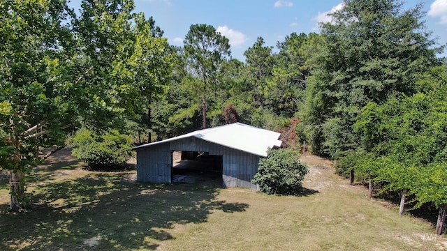 1737 S County Highway 183, Defuniak Springs, FL 32435 - view of pole building with a wooded view