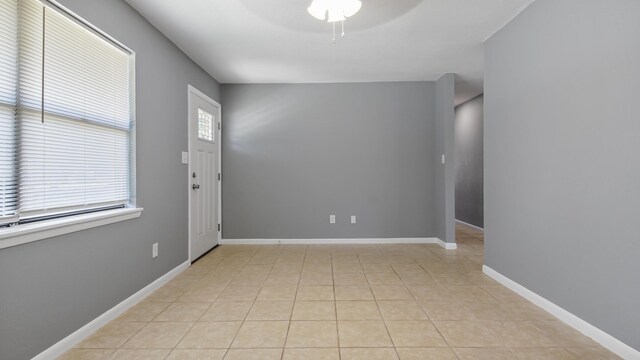 1737 S County Highway 183, Defuniak Springs, FL 32435 - empty room featuring ceiling fan, light tile patterned floors, and baseboards