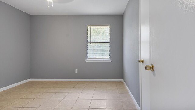 1737 S County Highway 183, Defuniak Springs, FL 32435 - spare room featuring light tile patterned flooring and baseboards