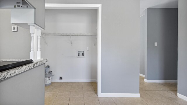 1737 S County Highway 183, Defuniak Springs, FL 32435 - laundry room with hookup for a washing machine, light tile patterned flooring, baseboards, and electric dryer hookup