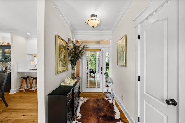 108 S Blue Heron Dr, Santa Rosa Beach, FL 32459 - entrance foyer with wood finished floors, crown molding, recessed lighting, and baseboards