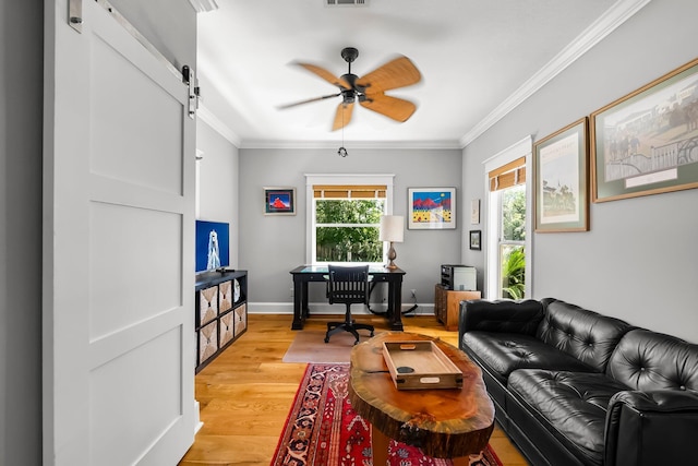 108 S Blue Heron Dr, Santa Rosa Beach, FL 32459 - office featuring ceiling fan, a barn door, light wood-style floors, and ornamental molding