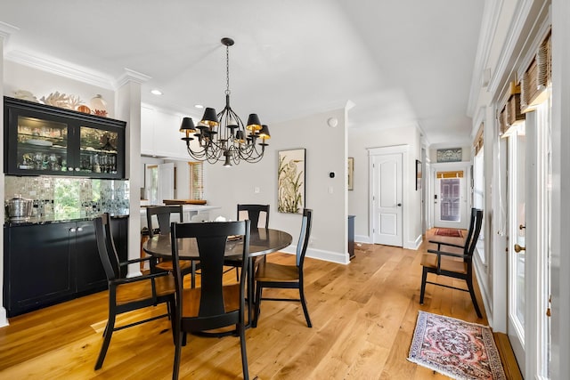 108 S Blue Heron Dr, Santa Rosa Beach, FL 32459 - dining space featuring a chandelier, light wood-type flooring, plenty of natural light, crown molding, and recessed lighting