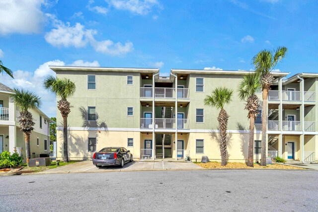 216 Bonita Cir Unit C, Panama City Beach, FL 32408 - view of apartment building / complex with uncovered parking