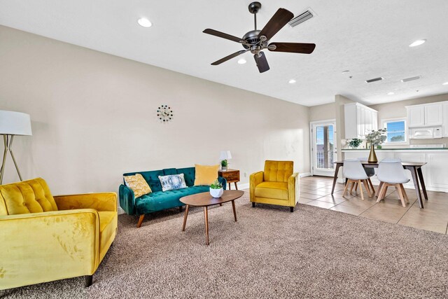 216 Bonita Cir Unit C, Panama City Beach, FL 32408 - living area with recessed lighting, a ceiling fan, light carpet, and light tile patterned floors