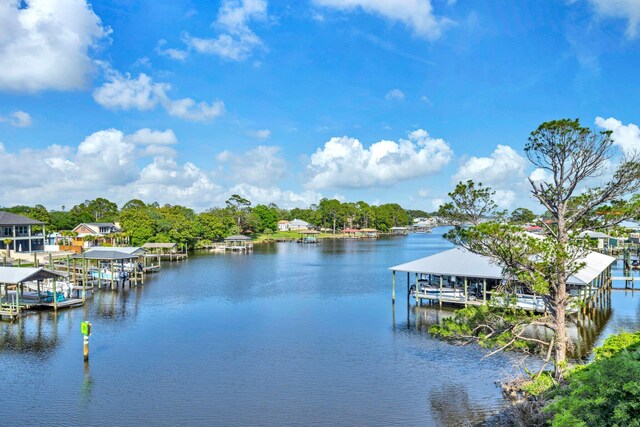 216 Bonita Cir Unit C, Panama City Beach, FL 32408 - dock with boat lift and a water view