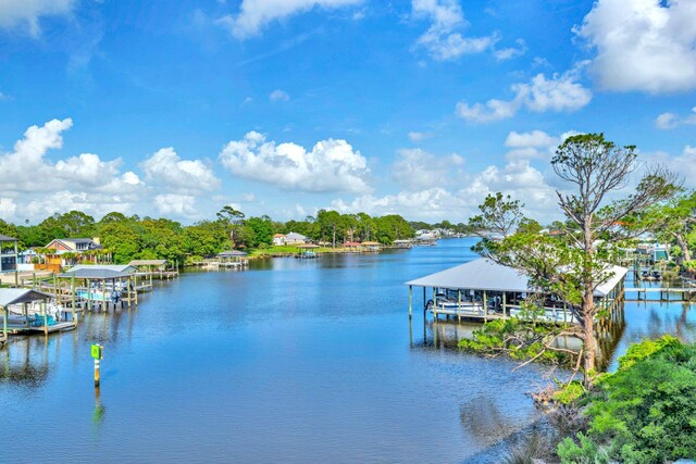 216 Bonita Cir Unit C, Panama City Beach, FL 32408 - dock area featuring boat lift and a water view