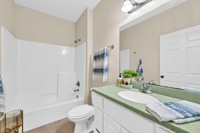 216 Bonita Cir Unit C, Panama City Beach, FL 32408 - bathroom with vanity, tub / shower combination, tile patterned floors, and toilet