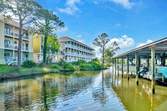 216 Bonita Cir Unit C, Panama City Beach, FL 32408 - dock featuring a water view and boat lift