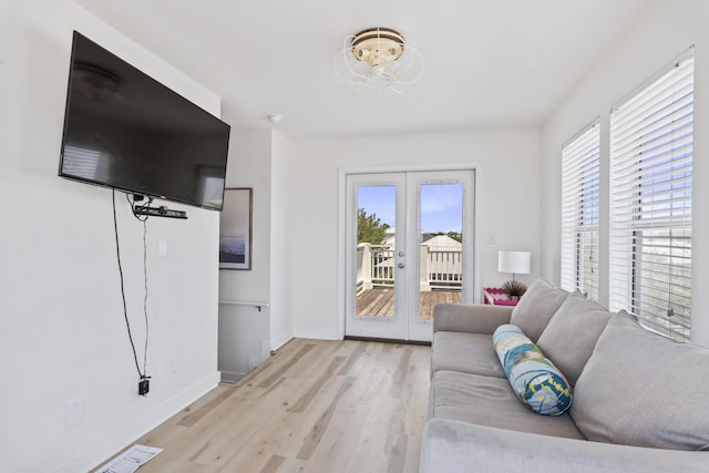 34 E Lifeguard Loop, Inlet Beach, FL 32461 - living room featuring french doors, plenty of natural light, and light wood finished floors