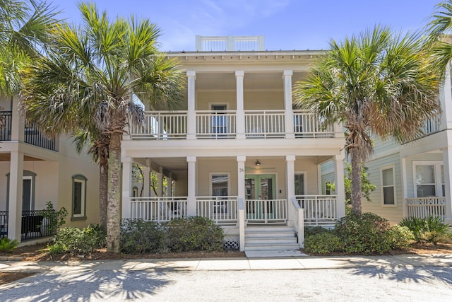 34 E Lifeguard Loop, Inlet Beach, FL 32461 - view of front of house with covered porch, a balcony, and french doors