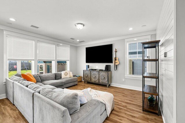 3204 Airport Rd, Panama City, FL 32405 - living area featuring baseboards, wood finished floors, recessed lighting, and crown molding