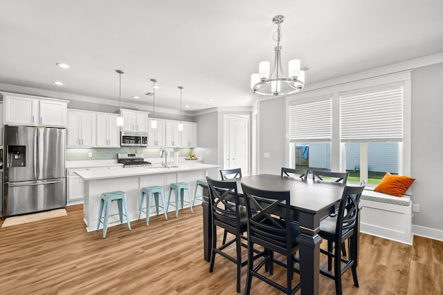 3204 Airport Rd, Panama City, FL 32405 - dining room with a chandelier, light wood-style floors, recessed lighting, and baseboards