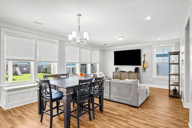 3204 Airport Rd, Panama City, FL 32405 - dining area with a chandelier, light wood-style flooring, baseboards, recessed lighting, and crown molding