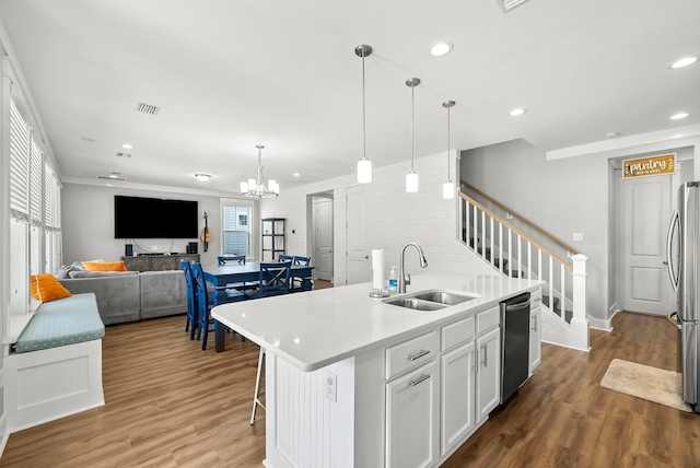 3204 Airport Rd, Panama City, FL 32405 - kitchen featuring a sink, open floor plan, wood finished floors, stainless steel appliances, and recessed lighting