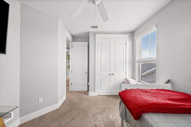 3204 Airport Rd, Panama City, FL 32405 - bedroom with carpet, a closet, baseboards, and ceiling fan